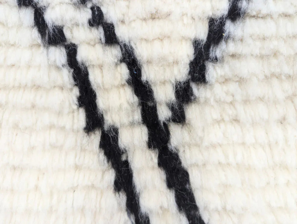 Zoom texture douce laine tapis berbère marocain