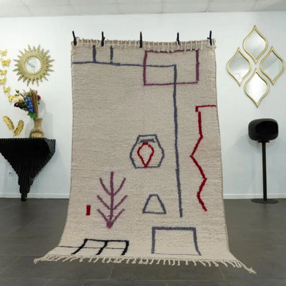 Tapis Beni Ouarain en laine naturelle avec motifs graphiques colorés, fait main au Maroc