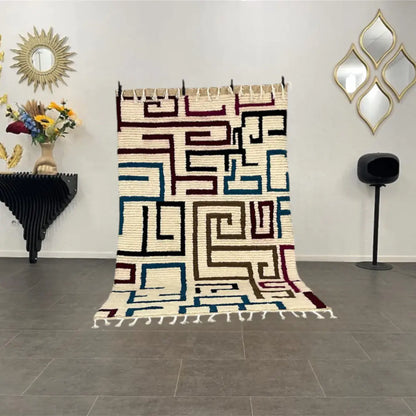 Tapis berbère authentique en laine naturelle, motifs géométriques multicolores tissés à la main au Maroc